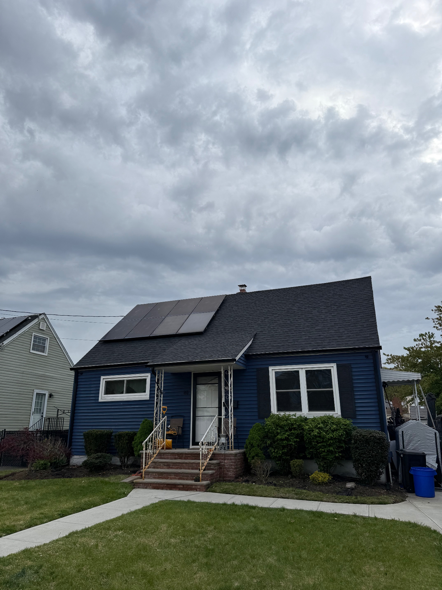 Cape Cod home in Belleville with new shingle roof and reinstalled solar panels
