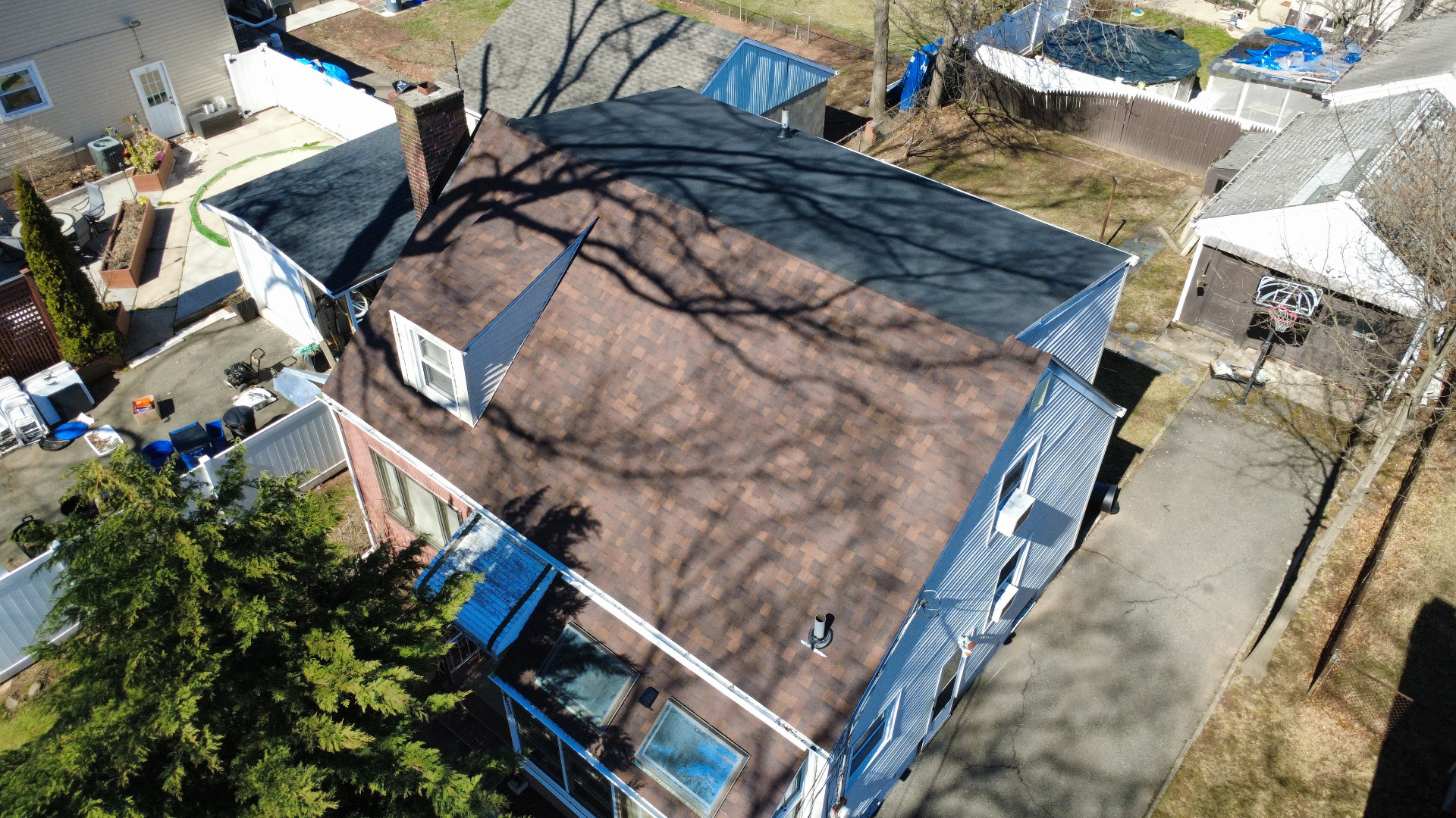 Aerial view of a completed multi-tone shingle roof
